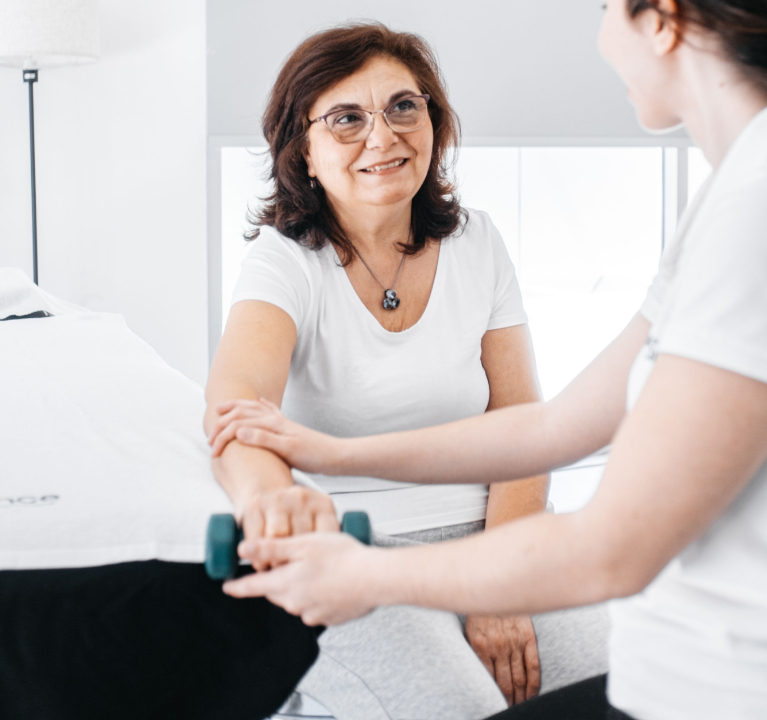 Physiotherapist helping a patient.